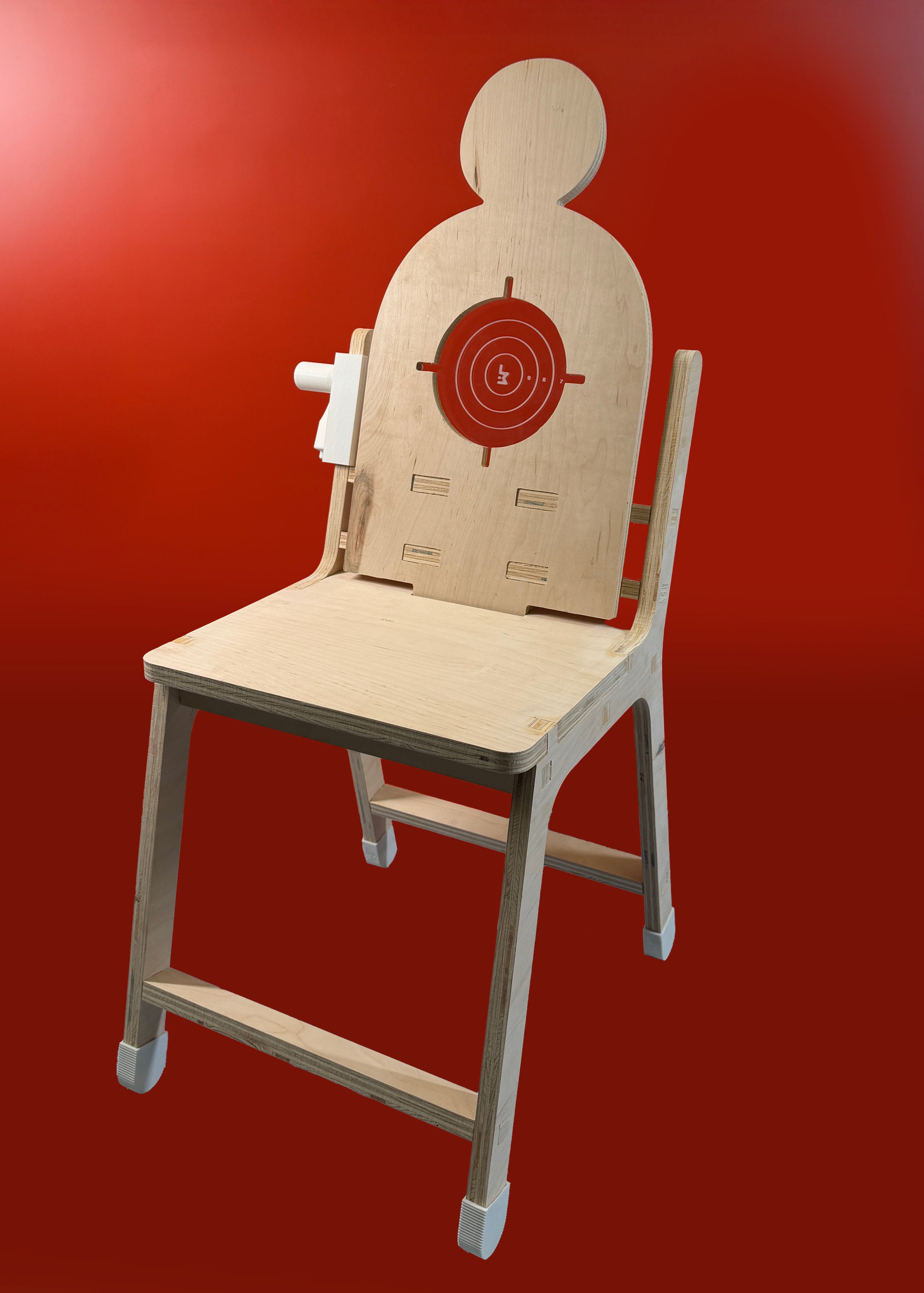 Chair with a cardboard target cutout on a red background